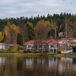 a row of houses next to a body of water
