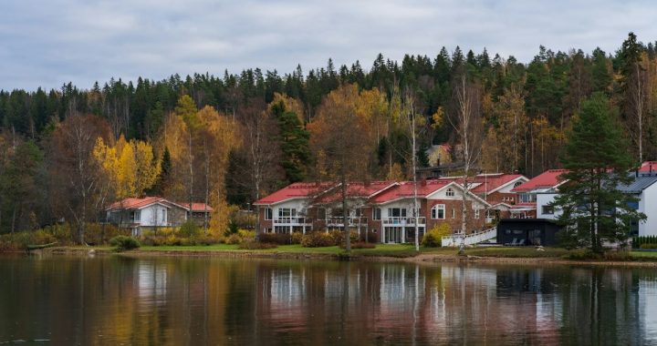 a row of houses next to a body of water