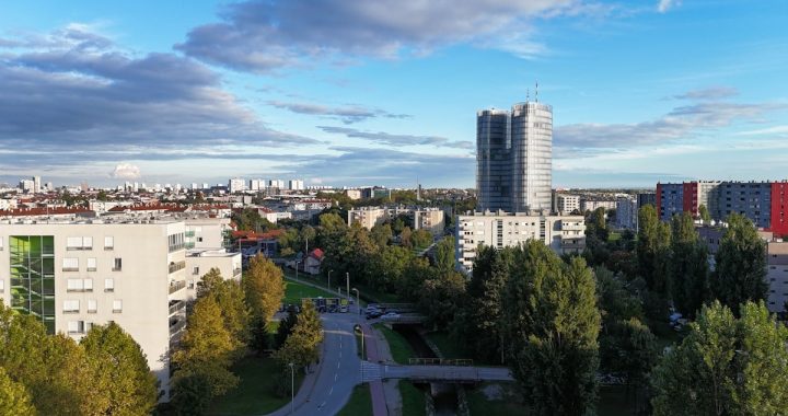 An aerial view of a city with tall buildings